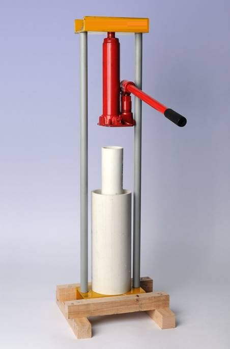 Figure 4: The press consists of a cylindrical die mounted vertically on a chassis. The raw materials are poured into the pipe and compacted with the block maker. Then a hole is placed on the pipe and compressed coals are thrown into it with pressure. Then the compacted coals are dried under the sun before storing and using [12].