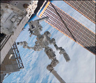 Figure 4: Dexter is attached to the end of the International Space Station’s robotic arm, Canadarm2. Credits: NASA [23].