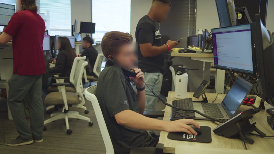 Figure 2: Redacted subjects sitting and standing at their workstations.