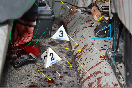 Figure 5: Blood Stains on the Floor of the Vehicle between the Driver’s and Passenger Seats and the Backseat where the Corpse was Found.
