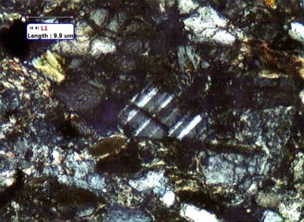 Figure 6: Thin section images of sandstone recovered from BH(A) (depth=3827-3837m) showing a pore.