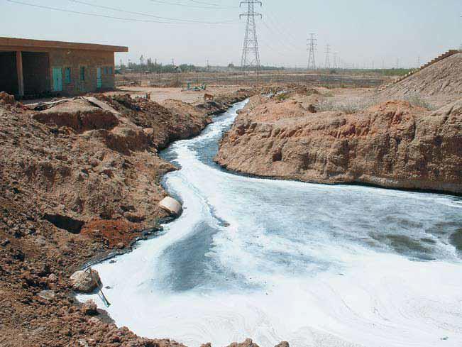 Figure 3: shows raw sewage flowing to the White Nile. Though there is a sewage network in Khartoum, it does not cover the entire city and no longer works properly, as it is stretched well beyond capacity • Roads are badly constructed and maintained due to lack of coordination between Ministry of Road and Transport with other related Ministries or government department such Ministry of Electricity and dams and telecommunication and Urban water resources corporation. This resulted in the continuous destruction of asphaltic roads to extend cables of electricity or telephones and domestic water supply networks [4]. • However, the present location of the central transport station is not suitable and has resulted in traffic jamming and wasting of time as well as increase fuel consumption that leads to increase in emitted air pollutants and noise pollution. Moreover, regardless of building of new hospitals and clinics most of the Sudanese have no access to health services because of its high costs and most of the people have no health insurance or their insurance cannot cover the actual expenses. 3) Horizontal expansion of Khartoum capital was not accompanied with accessible roads an d adequate transportation means [5]. 4) inadequate domestic water supply in Khartoum state: it is attributed to: human, institutional and managerial challenges as well as natural factors: Human factors which are responsible for water shortage of drinking water in urban areas can be summed up in the following: rapid urban expansion which resulted from poor development and absence of essential infrastructure in rural areas, insufficient number of domestic water treatment plants, limited capacity of networks, and failure of investment in water supply to match the growth of needs, While the demand is increasing of water losses are also increasing as a result of leakage and breakdown. The unaccounted for losses in the distribution systems in Khartoum are as high as 40%, the quality of urban water supply is also questionable. The following factors were identified to affect water quality: contamination of surface water by heavy loads of suspended loads during the flooding season, septic tanks and soak-away wells in urban areas and distribution networks are old and potential weak links. These factors present a constant threat of contamination of ground water sources [6].