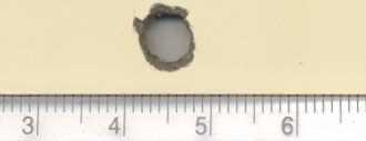 Figure 13: 8mm bullet entry hole 18”. Figure 14: 8mm bullet exit hole 18”.