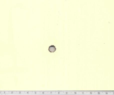 Figure 7: 8mm bullet entry hole 19”. Figure 8: 8mm bullet exit hole 19”.