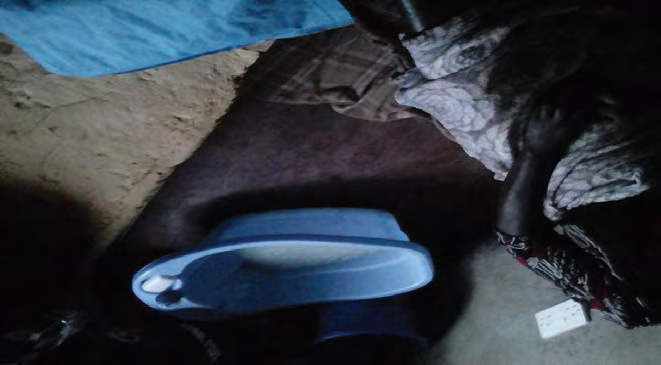 Figure 2: ** Seated in home labour room is the woman who assists in delivering of babies.