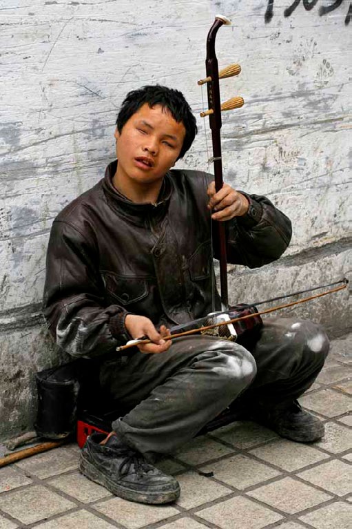 Figure 2: Blind Tujia Musician.