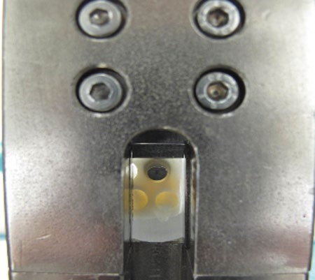 Figure 5: Excess resin cement (half-moon) sheared off with Zwick Z010, with a cross head speed of 0.75 mm/min.