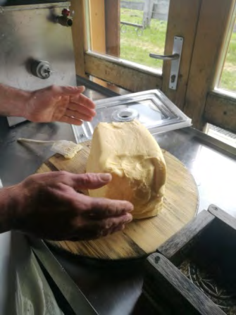 Figure 4: A dairyman is preparing the typical mountain butter in alpine hut.