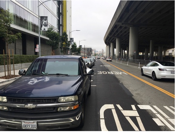 Figure 3: View of 7th Street from one block before area shown in Figures 1 & 2. Previous 4 lane configuration now 2 lanes. Continuation of bike lane on right and left. 7th Street is funneled from 4 lanes to 2 lanes prior to this intersection creating continuous traffic jams during most of the day.