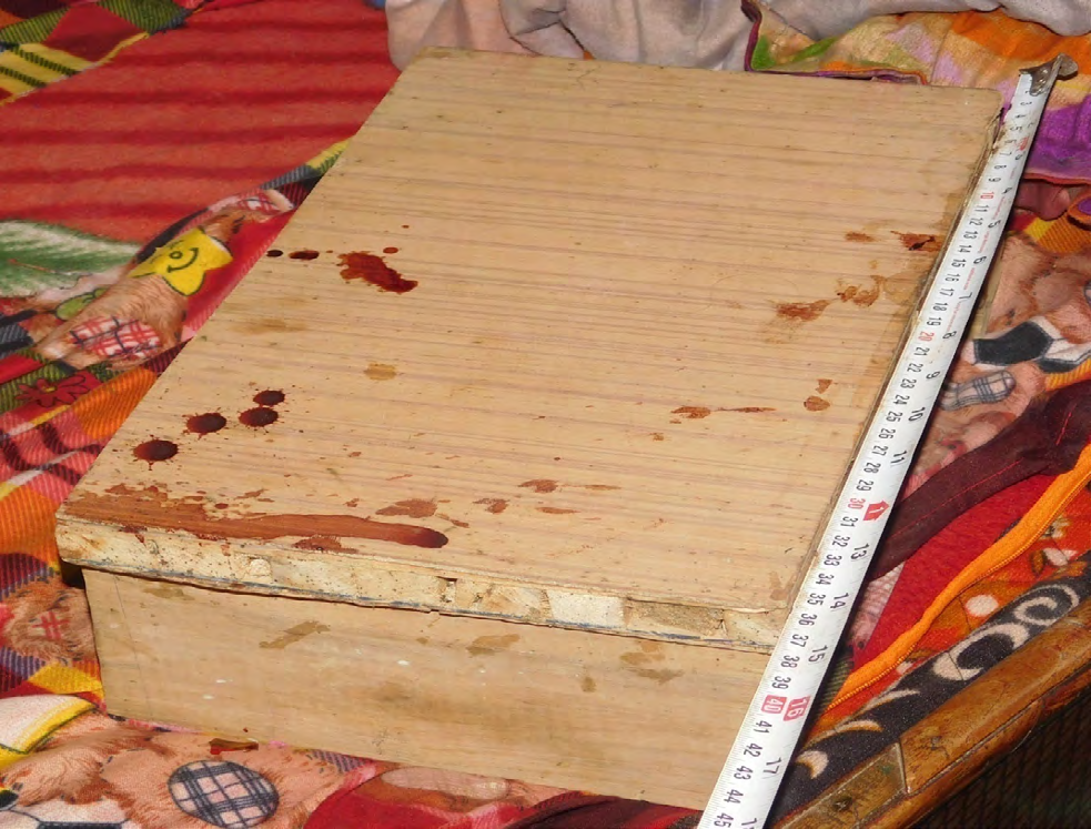Figure 13: Blood stained wooden stool.